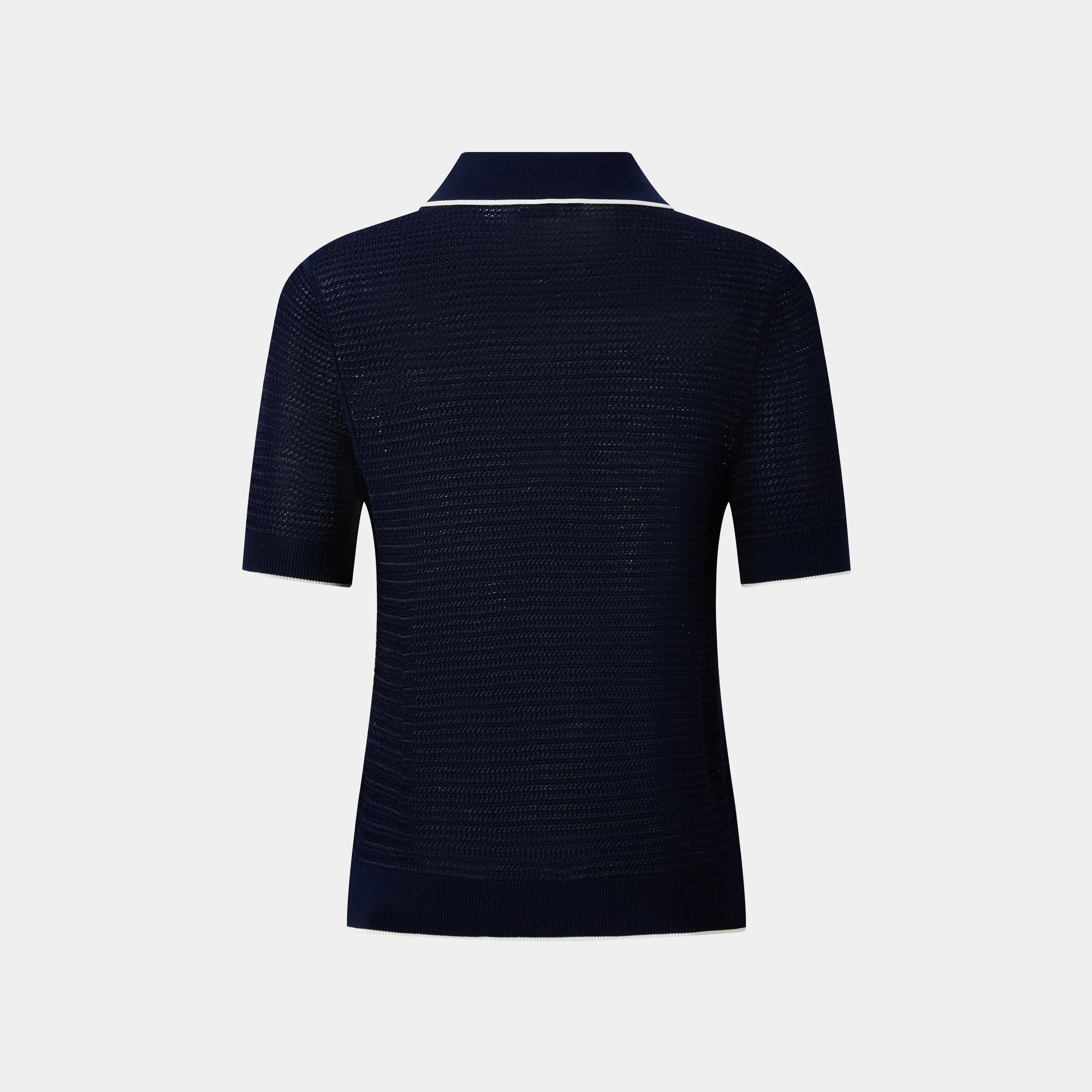 ELEGANT NAVY POLO FEATURING WHITE TRIM DETAILS, A TIMELESS WARDROBE STAPLE